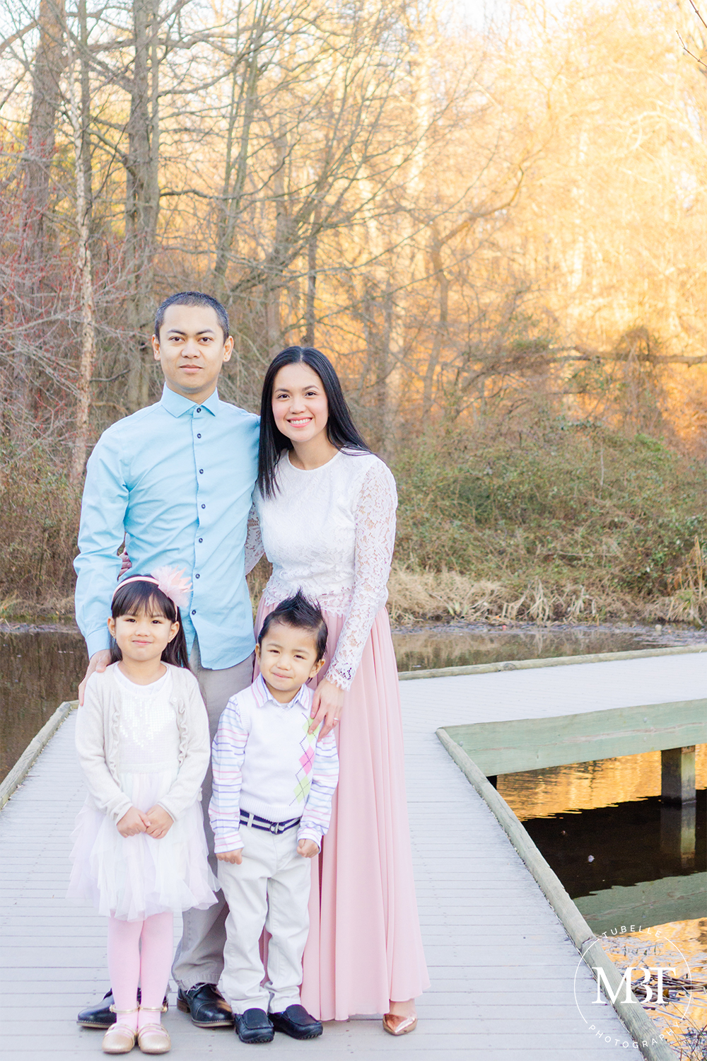 family portrait - family of 4 standing at a bridge on Chantilly, Virginia taken by a Northern Virginia family photographer