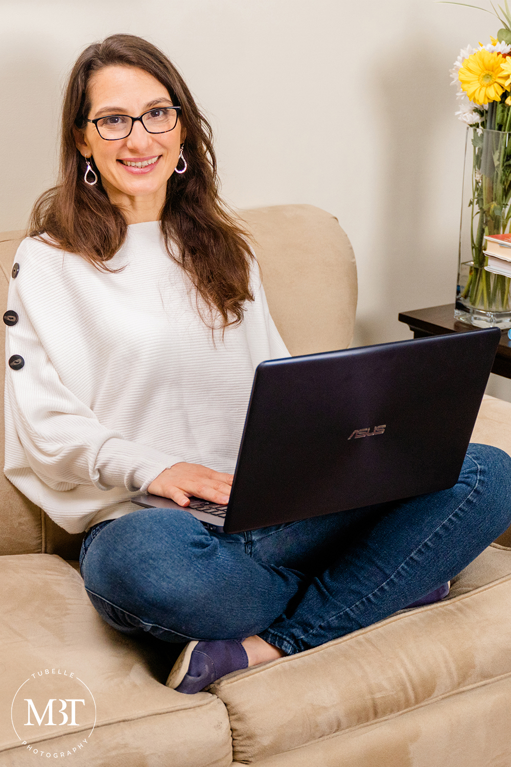 branding session - woman working on a laptop smiling, taken in Northern Virginia by a Washington DC lifestyle photographer
