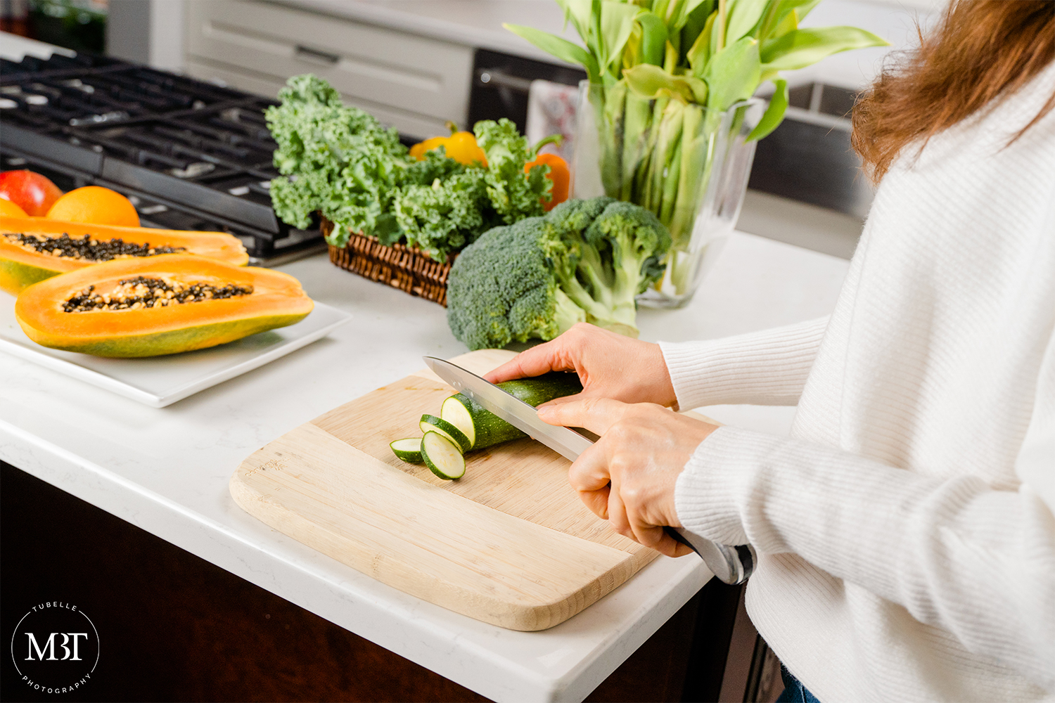 lifestyle session - life coach cutting vegetables taken in Virginia by a Northern Virginia branding photographer