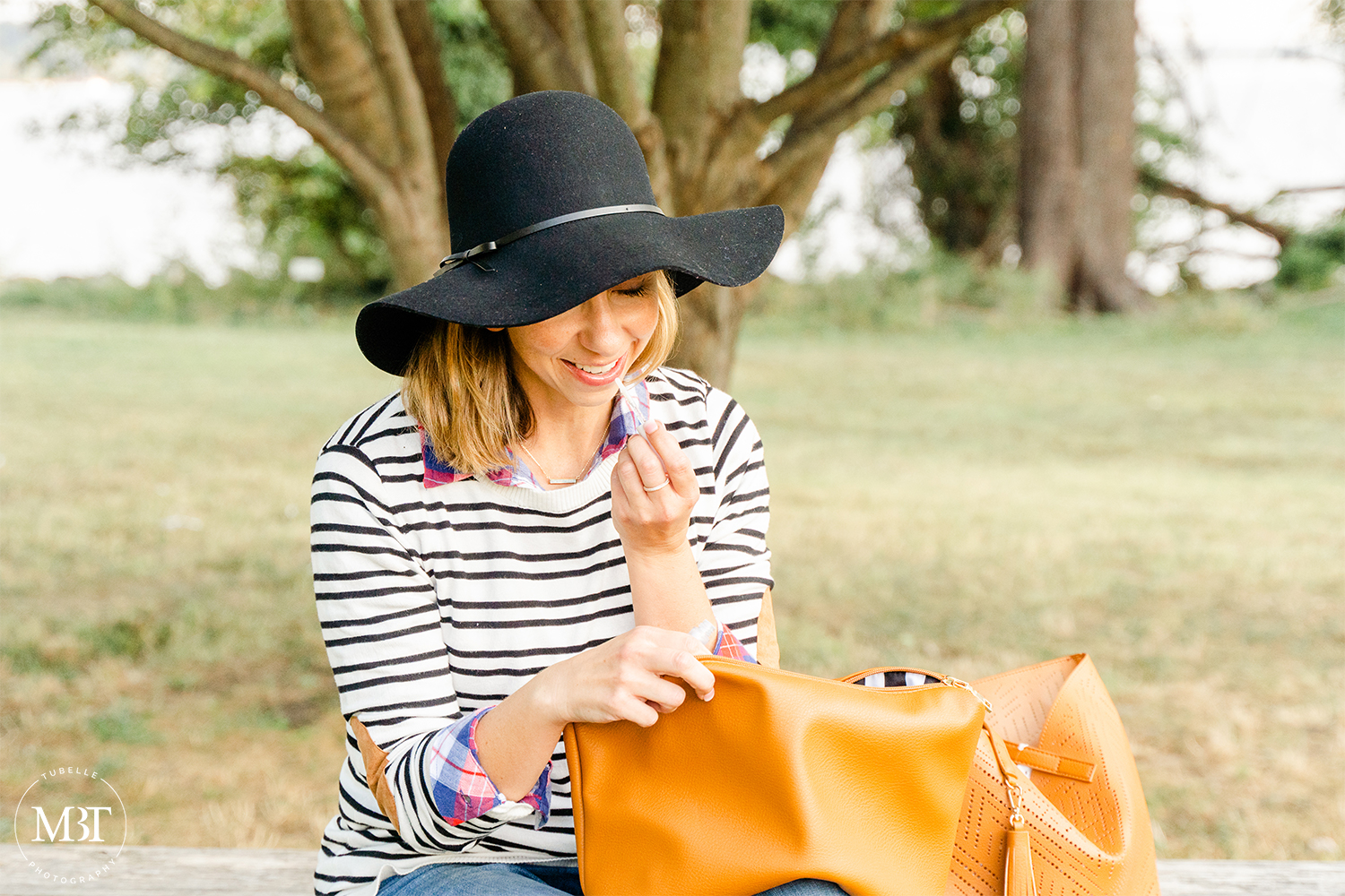 lifestyle session - fashion blogger applying lip gloss, taken in Alexandria, Virginia by a DMV branding photographer