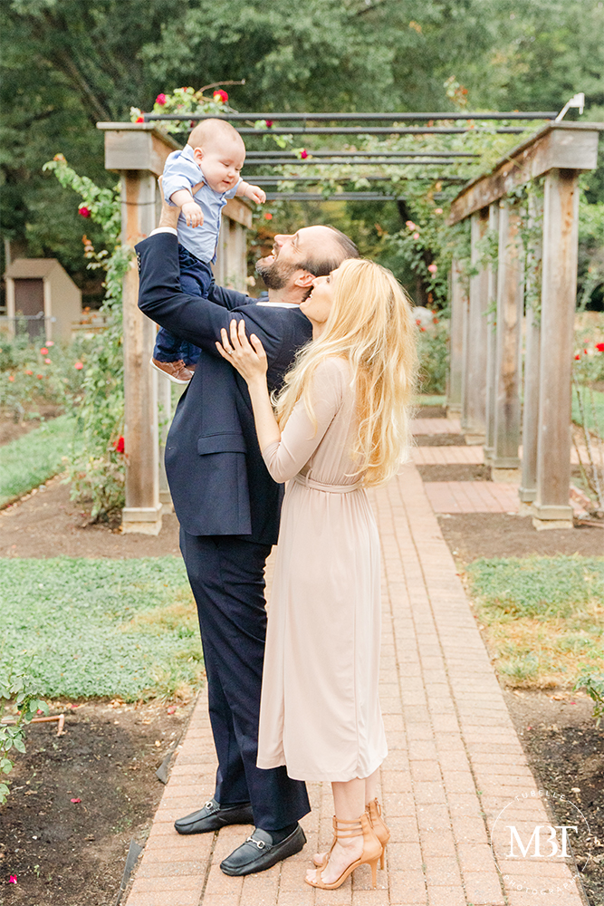 family of 3 playing during their family session at Bon Air Park in Arlington, Virginia by a NoVa family photographer