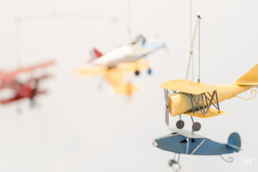 crib mobile with airplanes taken during at an home newborn session in Reston, Virginia by a NoVa newborn photographer