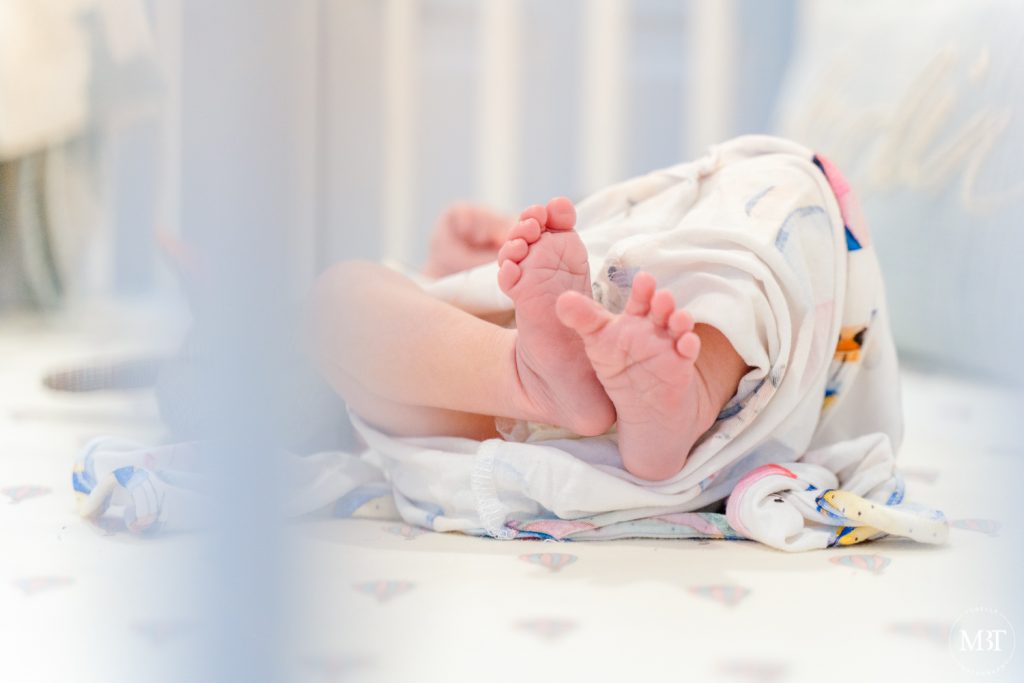 feet of a newborn baby during a lifestyle newborn session taken by a Virginia photographer
