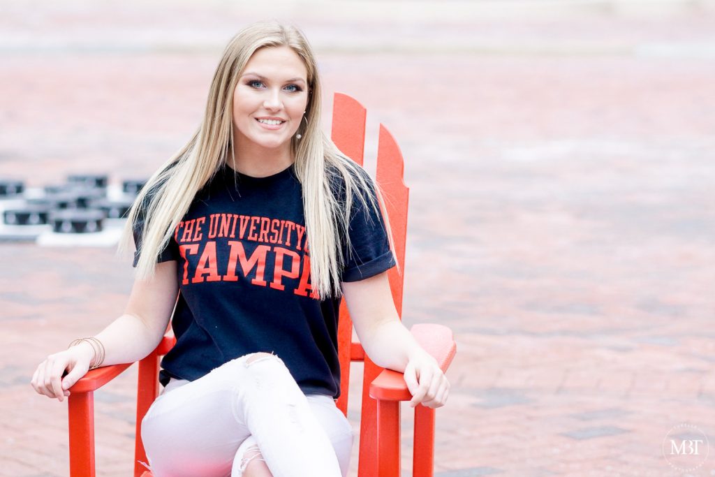 girl wearing a University of Tampa tee during her senior session in Reston, Virginia taken by a Washington, DC senior photographer