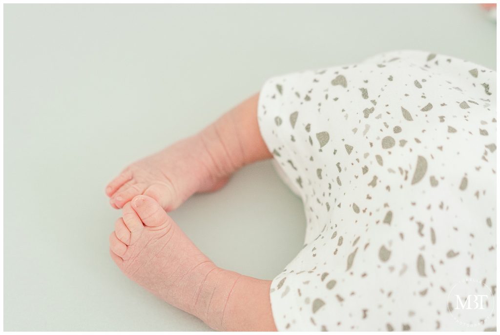 feet of a baby girl during their in home newborn pictures in Gainesville, Virginia, taken by TuBelle Photography, a Prince William County newborn photographer
