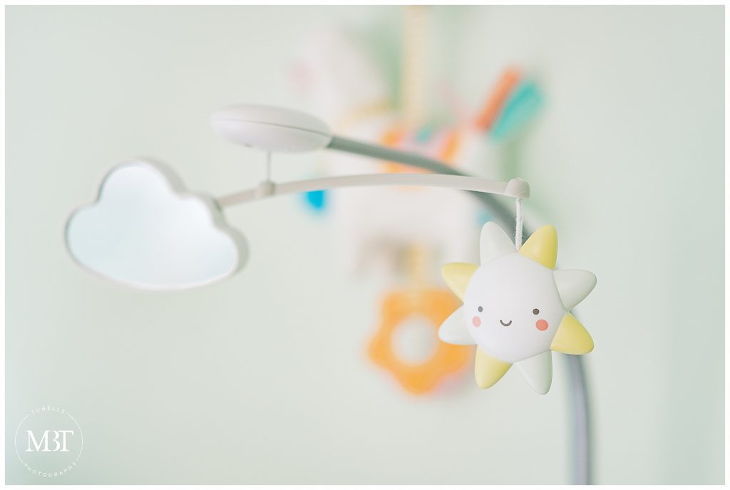 mobile of baby during their lifestyle newborn photos in Gainesville, Virginia, taken by TuBelle Photography, a Prince William County newborn photographer