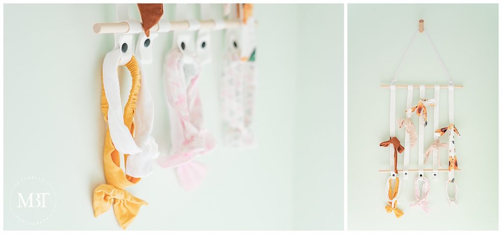 headband holder during their lifestyle newborn portraits in Gainesville, Virginia, taken by TuBelle Photography, a Northern Virginia newborn photographer