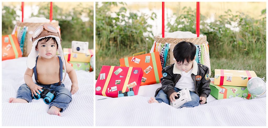 baby playing with camera and binoculars during time flies cake smash in Northern Virginia