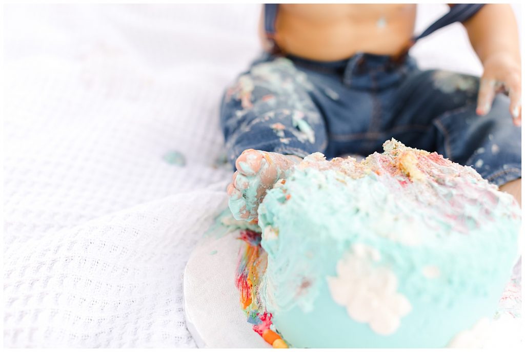 baby's foot on cake during time flies cake smash in Northern Virginia