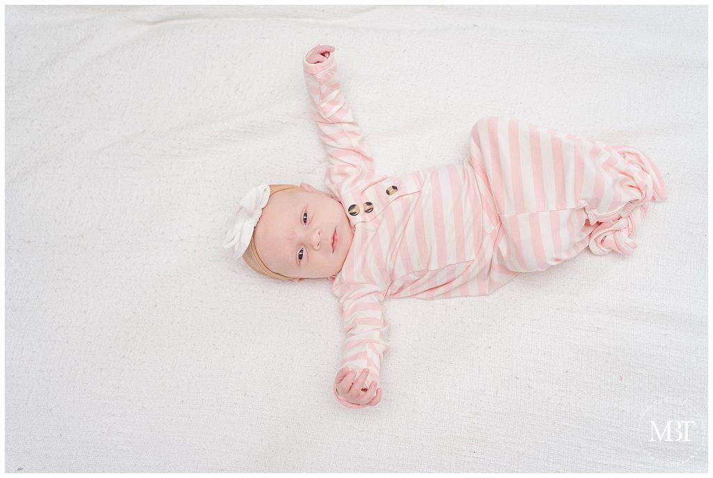 in-home newborn session in nova taken by Arlington Virginia newborn photographer TuBelle Photography of baby girl in pink