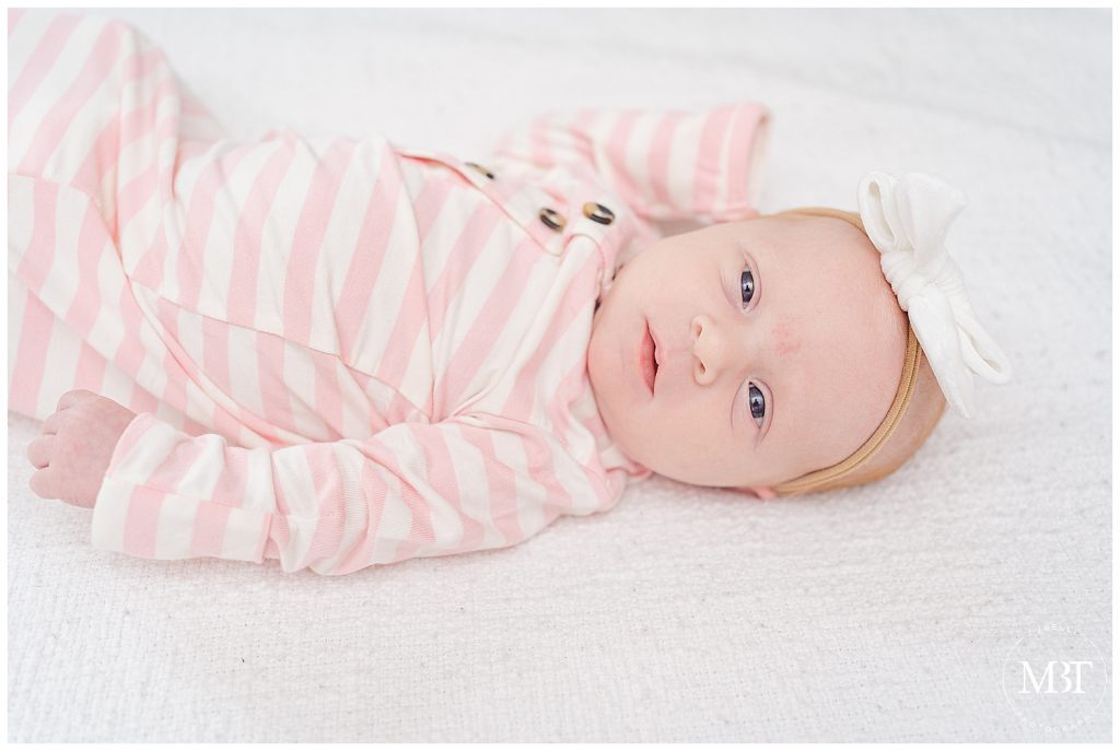 in-home newborn session northern virginia taken by TuBelle Photography in Arlington Virginia of baby girl in pink