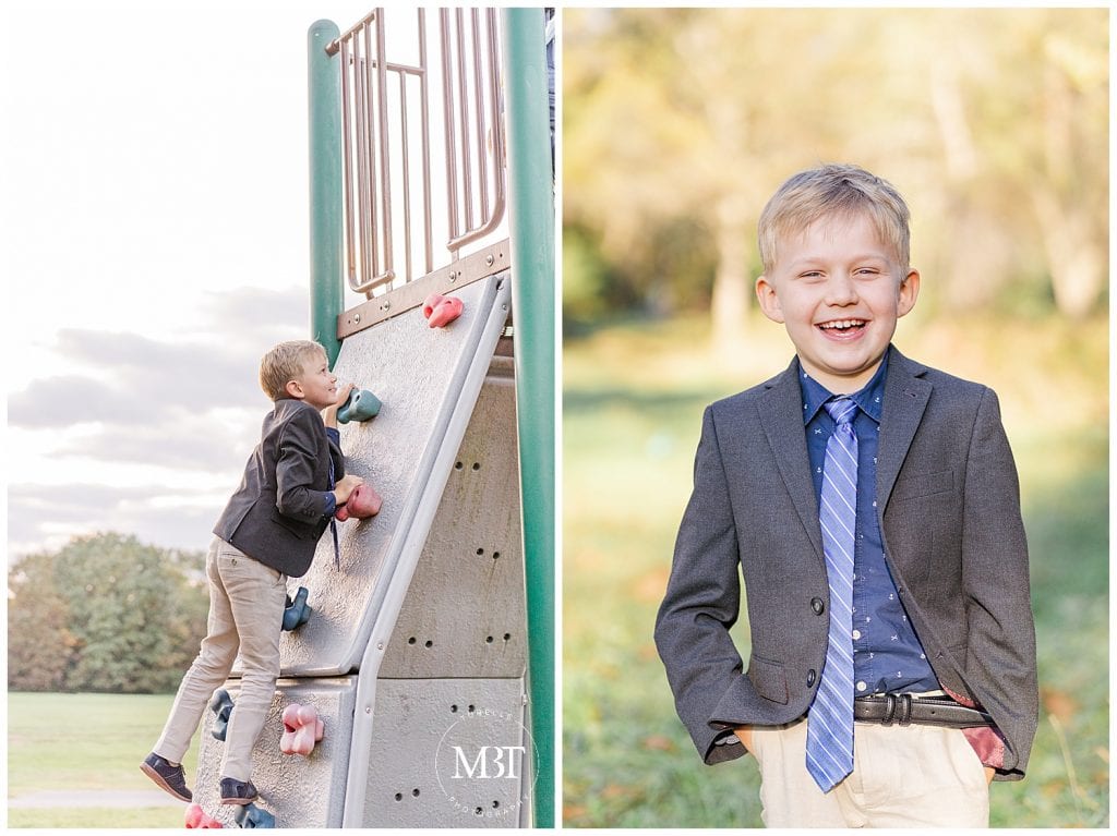 Little boy smiling and playing on climbing wall at Ellanor C. Lawrence Park in Northern VA taken by TuBelle Photography, a Fairfax County Family Photographer.