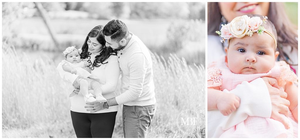 Mom and Dad look down lovingly at baby girl at their outdoor Christmas Minis taken by TuBelle Photography, a DMV Family Photographer.